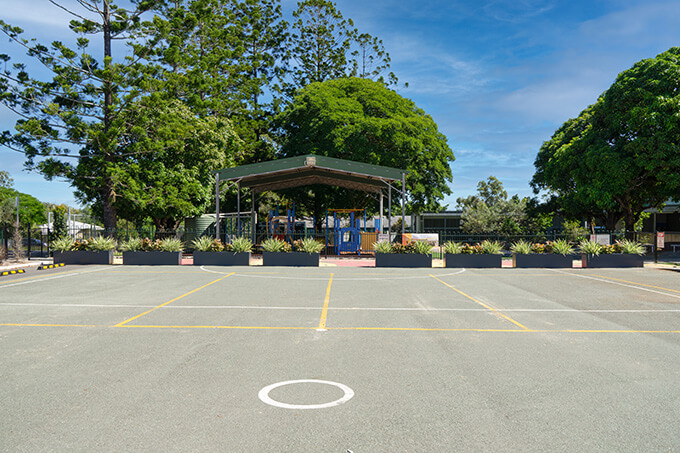 school parking lot with planters