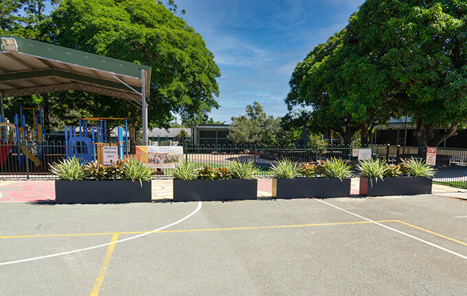 extra large planters in parking lot