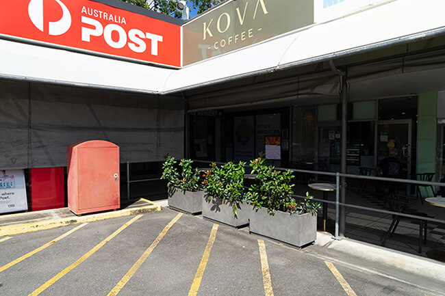 concrete rectangular planters at kova coffee and post office